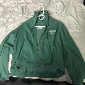 A Women’s American Eagle zip up hoodie in the size large